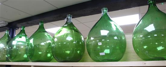 Six green glass carboids and two clear glass ditto tallest 63cm